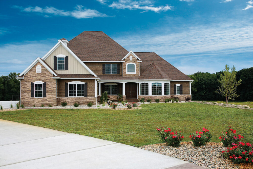 Home exterior clad in Plum Creek Versetta Stone Ledgestone