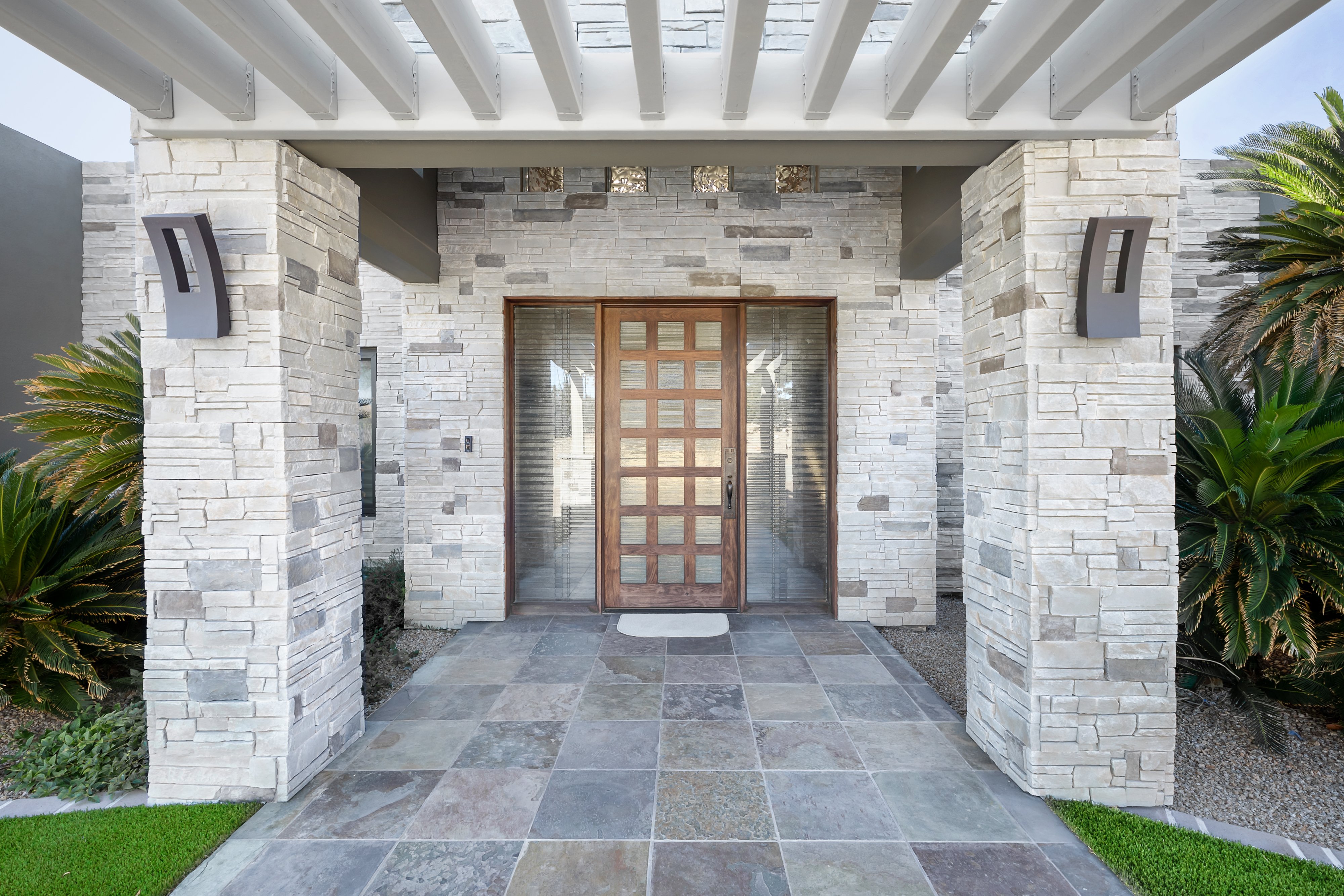 Modern entry clad in dry-stacked Versetta Stone