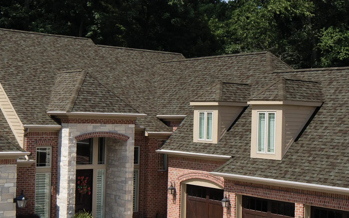 Completed roof in Owens Corning Driftwood shingles, installed in the Kansas City metro