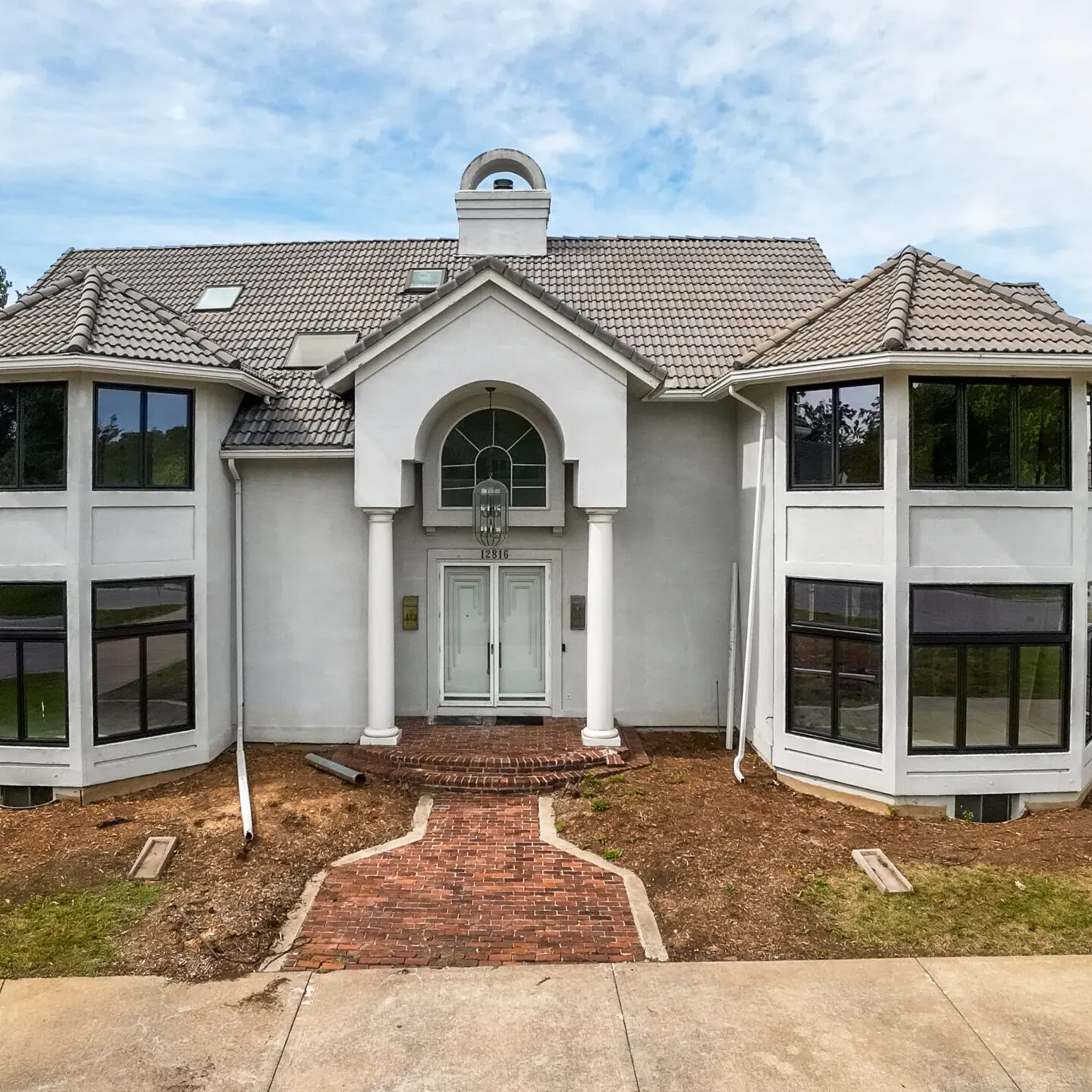 New black windows on white stucco