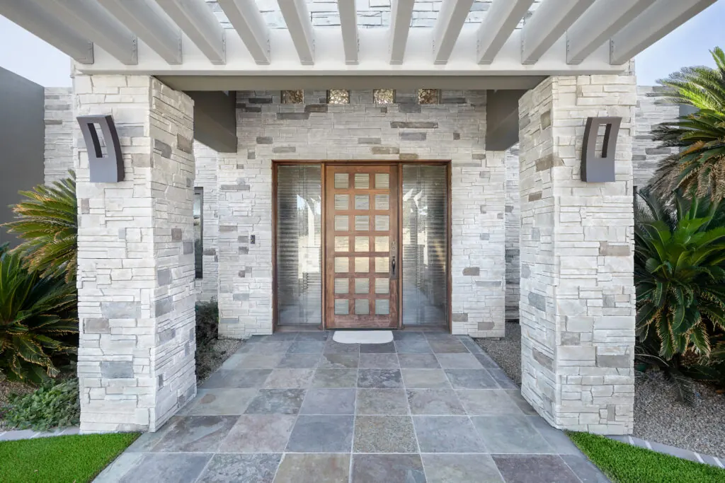Modern entry clad in dry-stacked Versetta Stone Ledgestone
